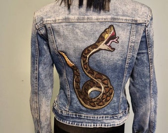 Vintage 80s denim jacket with laces and snake patch. Size L