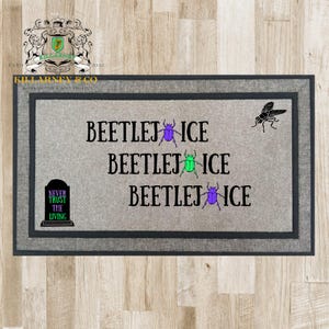 May include: Rectangular gray doormat with a dark gray border. The mat features the text "BEETLEJ ICE" repeated three times, with purple and green beetle graphics. A black fly graphic is in the upper right corner, and a tombstone graphic with the text "NEVER TRUST THE LIVING" is in the lower left corner.