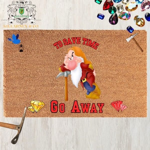 May include: A rectangular doormat with a cartoon image of a grumpy dwarf holding a pickaxe. The text "TO SAVE TIME GO AWAY" is printed in red. The mat is brown with a rough texture, and the dwarf is wearing a red jacket and blue pants.