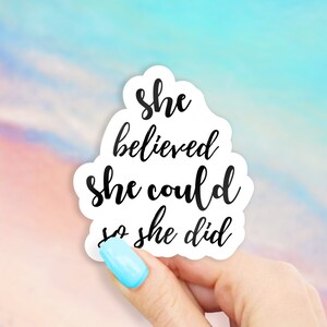 May include: White sticker with black text that reads "She believed she could so she did".