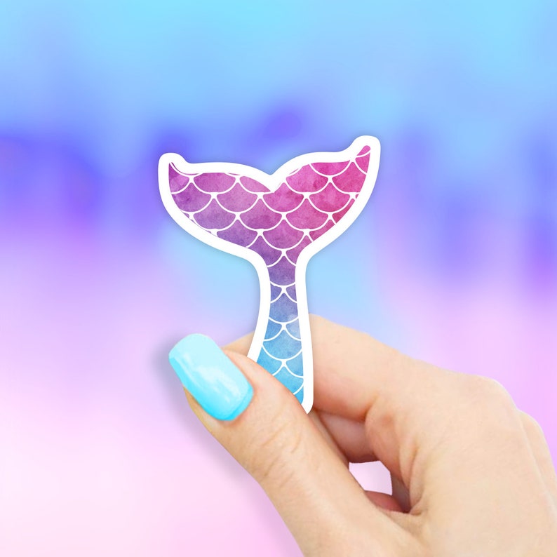 May include: A sticker of a mermaid tail with a watercolour design of pink, purple, and blue scales.