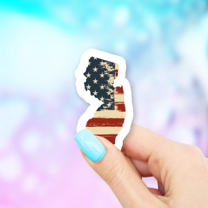May include: A sticker of the state of New Jersey with a distressed American flag design.
