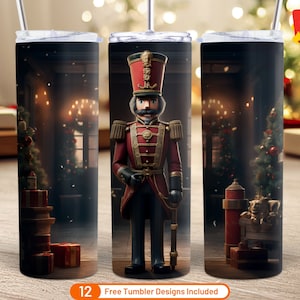 May include: A set of three 20 oz tumbler designs featuring a Nutcracker soldier standing in front of a Christmas tree and fireplace. The tumblers are white with a black rim and handle.