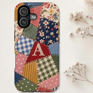 May include: A smartphone case featuring a patchwork design of various fabric patterns including floral prints, blue and white gingham, green and white gingham, and polka dots in pink and green, with a large beige letter A centered on the front.