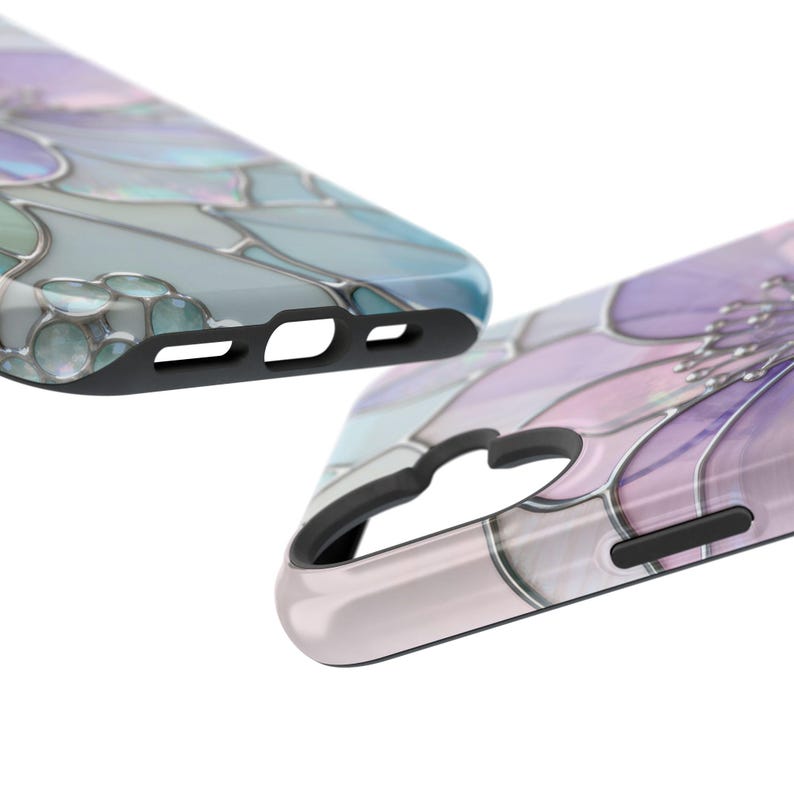 May include: Two phone cases with a floral design. One case is light blue and the other is purple, with a stained glass effect. The cases have black edges and cutouts for the phone's features.