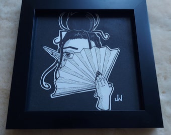 May include: Black framed art print featuring a black and white illustration of a person holding a fan. The person's eye is visible, and the fan is partially open. The artwork has a minimalist style with fine lines and details.