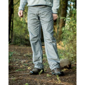 May include: A pair of gray pants with a straight leg fit. The pants are made of a lightweight, wrinkle-resistant fabric. The person wearing the pants is standing on a path in a forest.