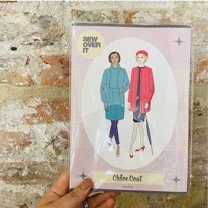 May include: Sew Over It Chloe Coat sewing pattern featuring two women wearing different versions of the coat. The pattern is for sizes 8-20.