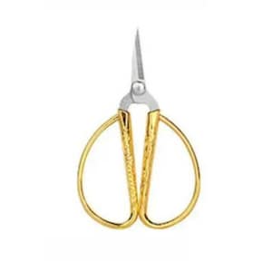 May include: A pair of gold-colored scissors with a silver blade. The handles have a looped design and a textured pattern. The scissors are designed for precision cutting.