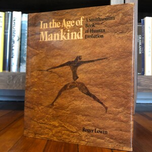 In the Age of Mankind by Roger Lewis first edition, first printing, published in 1988 by the Smithsonian Institution