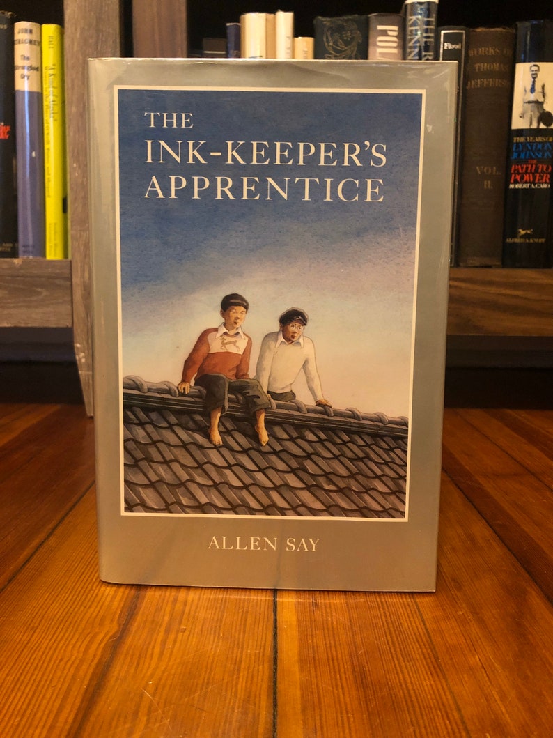 The Ink-keepers Apprentice by Allen Say, Houghton Mifflin Company, 1994, first printing of this edition, signed with a doodle image 1