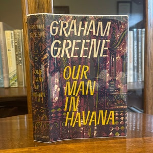 Our Man in Havana de Graham Greene, Primera edición, Primera impresión, Heinemann 1958