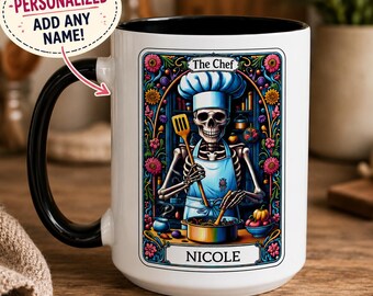 May include: A white ceramic mug with a black handle and interior featuring a colorful tarot-style illustration of a skeleton wearing a chef hat and apron, holding a spatula over a cooking pot, with the text The Chef and the name NICOLE printed.