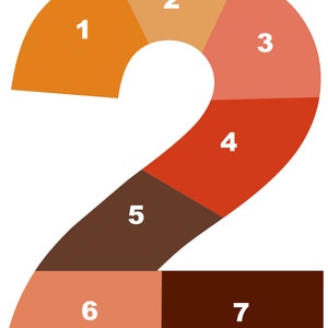 May include: A number two made of seven different colored sections. The sections are orange, peach, coral, red, brown, and two shades of brown. Each section is numbered 1 through 7.