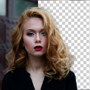 May include: A woman with long, curly blonde hair wearing a black top and red lipstick. She is looking directly at the camera.