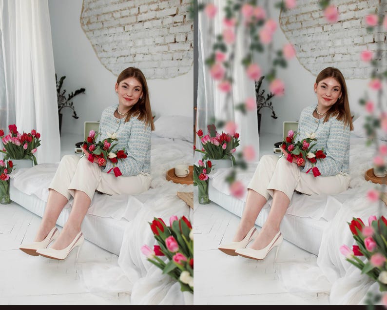May include: A woman in a light blue jacket with a white and blue pattern sits on a white bed with a bouquet of red and pink tulips in her lap. She is wearing white pants and white heels. The background is a white brick wall.