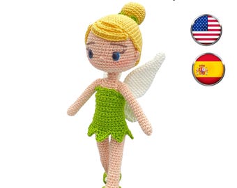 May include: A handmade crochet doll with a green dress, yellow hair, and white wings. The doll has a sweet expression and is standing on a white background. The text "PDF pattern" is visible in the image.