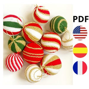 May include: A collection of handmade Christmas ornaments in various colors. The ornaments are primarily red, white, and green, with gold accents. Some have striped patterns, while others are solid. The image also includes the text "PDF".