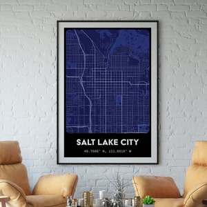 May include: A dark blue map print of Salt Lake City, Utah. The map shows the city streets and landmarks. The text "SALT LAKE CITY" and the coordinates "40.7608° N, 111.8910° W" are printed below the map.