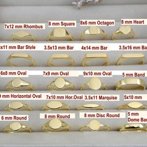 May include: A collection of gold-colored rings in various shapes, including square, heart, oval, and round designs. Each ring is displayed with its size in millimeters or inches, showcasing a variety of styles for potential customers.