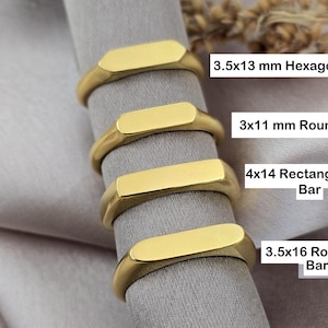 May include: Four gold-colored rings with different bar shapes: 3.5x13 mm Hexagon Bar, 3x11 mm Round Bar, 4x14 Rectangular Bar, and 3.5x16 Rounded Bar. The rings are displayed on a gray fabric.