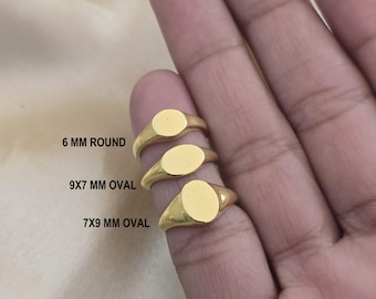 May include: Three gold-colored signet rings with different shaped faces: 6 mm round, 9x7 mm oval, and 7x9 mm oval. The rings are displayed on a hand, with the text indicating the shape and size of each ring.