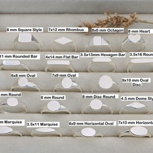 May include: A selection of silver rings showcasing diverse designs, including square, rhombus, octagon, and heart shapes. Each ring has a smooth, blank surface, with sizes and styles labelled, such as 8 mm Square Style and 7x12 mm Rhombus.