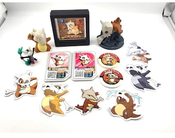 Lote de figuras Cubone Marowak, pegatinas de Amada, fichas y galería