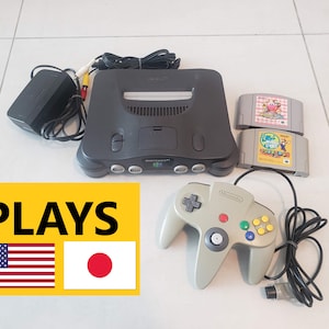 Nintendo 64 Region Free console + 2 cardtriges. Plays USA and Japan games!