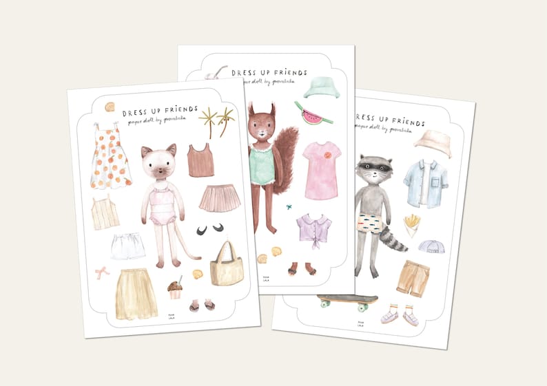 May include: Three illustrated paper sheets with the text "DRESS UP FRIENDS" feature animal characters and clothing. A cat, squirrel, and raccoon are depicted with outfits like dresses, skirts, shirts, and accessories. The illustrations are in soft watercolor tones.