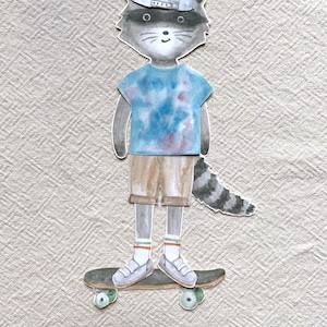 May include: A watercolor illustration of a raccoon wearing a backwards baseball cap, tie-dye t-shirt, and shorts, standing on a skateboard. The raccoon has a striped tail and is wearing sneakers and socks.