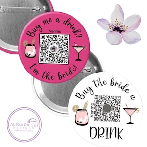 May include: Two round pink and white buttons with a QR code, the text "Buy me a drink? I'm the bride!" and a martini glass. The buttons are for a wedding or bridal shower.