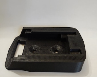 May include: Black plastic 3D printed mount with two holes and a slot.