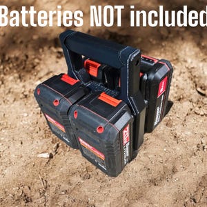 May include: A black plastic battery holder with a handle, holding three black and red 20V lithium-ion batteries. The text "Batteries NOT included" is visible at the top of the image.
