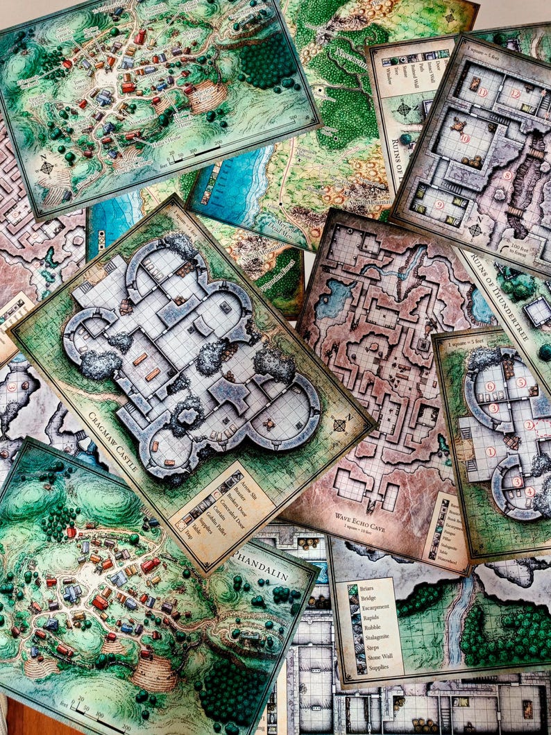 May include: A collection of fantasy role-playing game maps, including Cragmaw Castle, Wave Echo Cave, Ruins of Thundertree, and Phandalin. The maps are printed on thick paper and feature detailed illustrations of the locations.