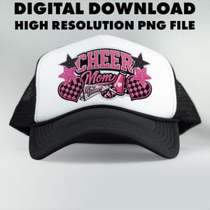 May include: A black and white trucker hat with a white front panel. The panel displays the words "Cheer Mom" in pink, alongside pink stars, hearts, and a pom-pom graphic. The text "Go Team!" is also included.