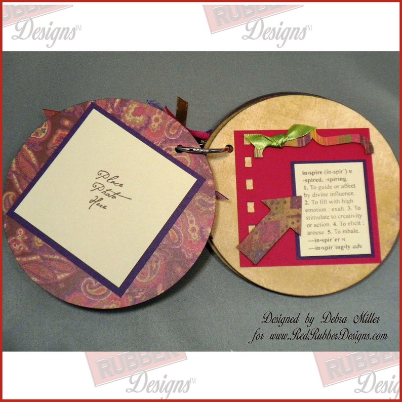 A handmade circle photo album showing off the vintage-style Well-Defined Backgrounds Unmounted Rubber Stamp set which has various dictionary definitions of words such as Birthday, Love, Art, Dream, Friend and more.