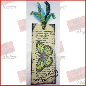 A handmade tag showing off the vintage-style Well-Defined Backgrounds Unmounted Rubber Stamp set which has various dictionary definitions of words such as Birthday, Love, Art, Dream, Friend and more.