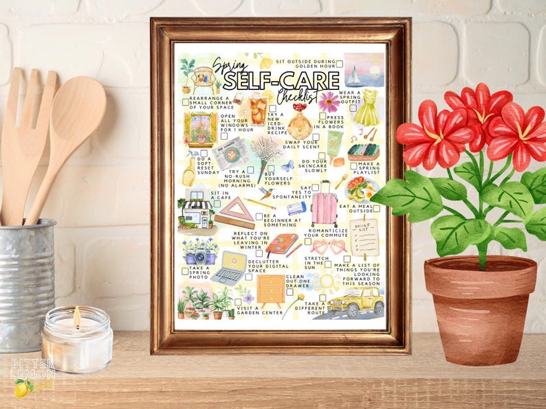 May include: A framed watercolour print titled "Spring Self-Care Checklist" with illustrated self-care activities. A potted plant with red flowers is on the right. Wooden utensils and a lit candle are in the background.