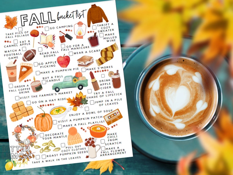 May include: A seasonal bucket list featuring autumn-themed illustrations, such as apple picking, pumpkin pie, and warm sweaters. A coffee cup with latte art sits on a teal saucer, with blurred fall leaves in the background.