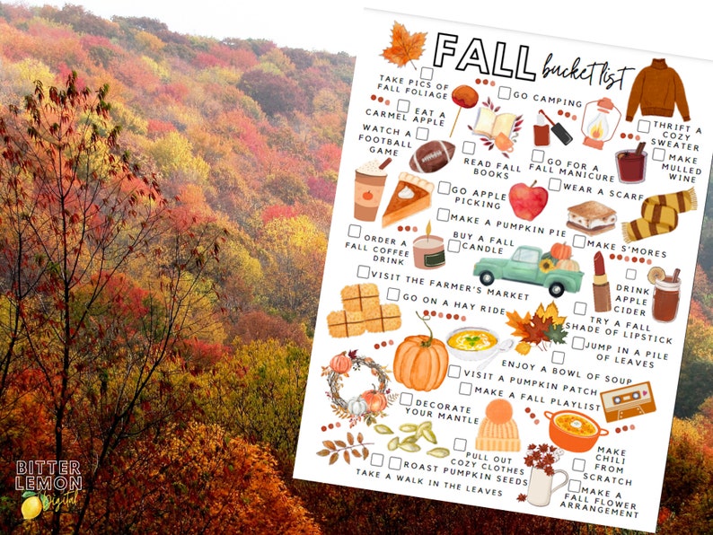 May include: A seasonal print with a "Fall Bucket List" featuring illustrations of autumn activities. The list includes things like apple picking, pumpkin pie, and cozy sweaters. The background shows a vibrant autumn forest with red, orange, and yellow foliage.