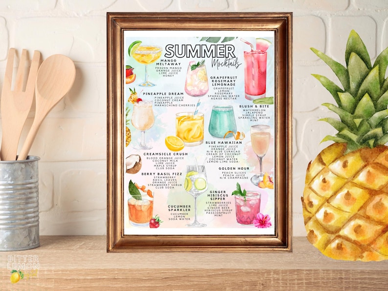 May include: A framed print featuring watercolor illustrations of summer mocktails. The print includes the text "SUMMER Mocktails" and showcases various drink recipes like Mango Meltaway, Pineapple Dream, and Blush & Bite. A pineapple is visible on the right.
