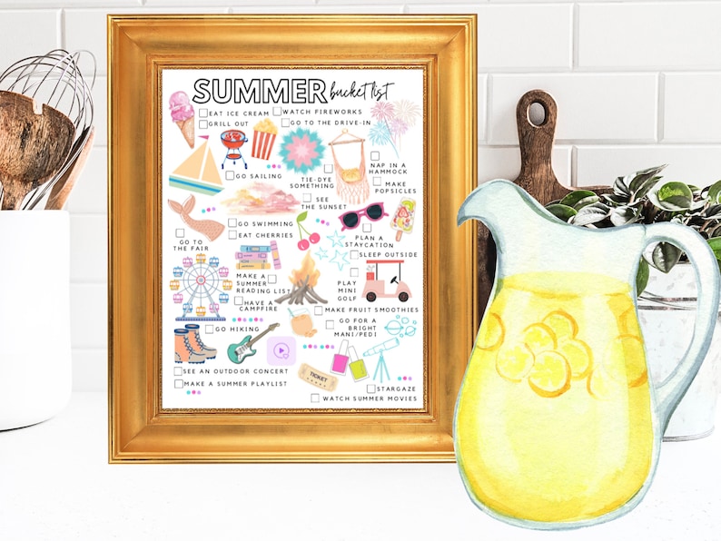 May include: A framed print with a gold border features a "Summer Bucket List" with colorful illustrations and checkboxes. The list includes activities like eating ice cream, watching fireworks, and stargazing. A watercolor pitcher of lemonade is on the right.
