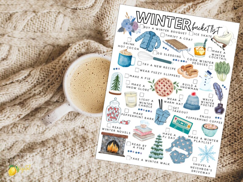 May include: A cozy winter-themed image featuring a white mug of coffee on a cream-colored knitted blanket next to a "Winter Bucket List" checklist. The checklist includes illustrations of winter activities like ice skating, drinking hot cocoa, and building a snowman.
