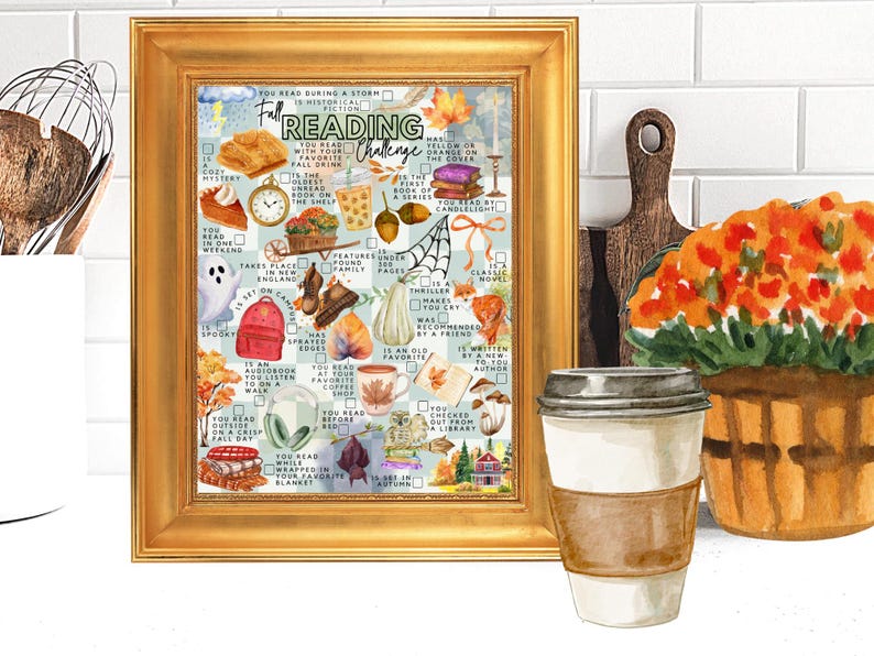 May include: A gold-framed print featuring a Fall Reading Challenge checklist. The artwork includes watercolor illustrations of autumn-themed items like pumpkins, leaves, books, a ghost, and a coffee cup, with text prompts for various reading tasks.
