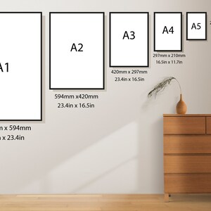 May include: A display of framed art prints in various sizes, including A1 (33.1 x 23.4 inches), A2 (23.4 x 16.5 inches), A3 (16.5 x 11.7 inches), A4 (11.7 x 8.3 inches), and A5 (8.3 x 5.8 inches). A wooden dresser and decorative vase are also in the image.