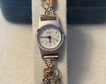 Reloj de cuarzo Armitron dorado Black Hills para mujer - Correa de oro de ley de 12 k