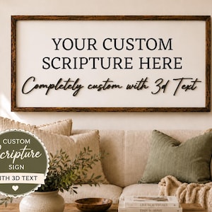 May include: A framed sign with the text "YOUR CUSTOM SCRIPTURE HERE" and "Completely custom with 3d Text". A circular sticker reads "CUSTOM Scripture SIGN WITH 3D TEXT". The sign is above a beige sofa with pillows.