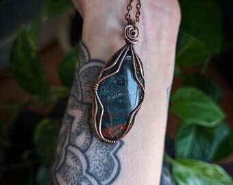 Handmade bloodstone copper wirewrapped crystal pendant.