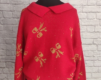 Pull de Noël rouge vintage des années 80 avec des nœuds dorés